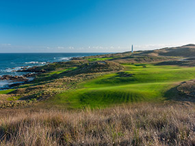 The par four 14th played toward the Cape Wickham Lighthouse