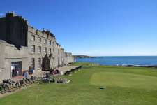 The 1st tee at Ardglass up against an ancient Castle structure