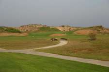 Pressed against the dunes the 17th Green