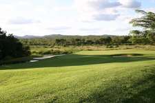 Leopard Creek 13th Green with Kruger National Park as a backdrop