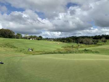 View of par three 12 from behind 11th green