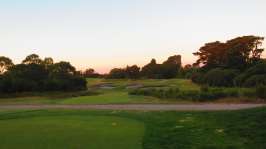 The beautifully bunkered par three 16th hole