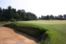 Deep greenside bunkering at the short 12th